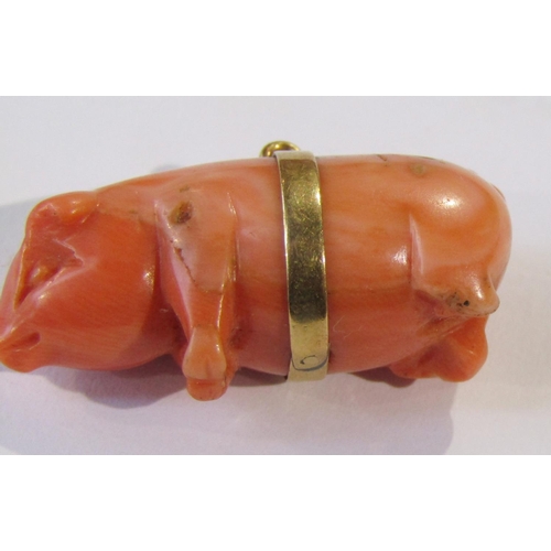 284 - Yellow metal mounted carved coral pig charm, 3cm L approx, 8.4g (back legs af)