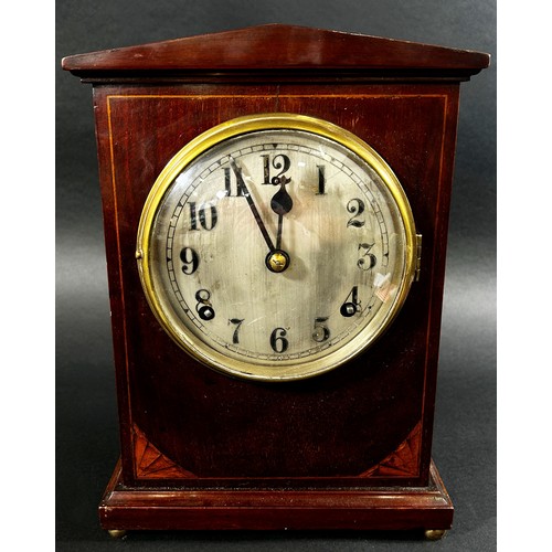 434 - An inlaid mahogany Edwardian mantle clock, with silvered dial, pendulum