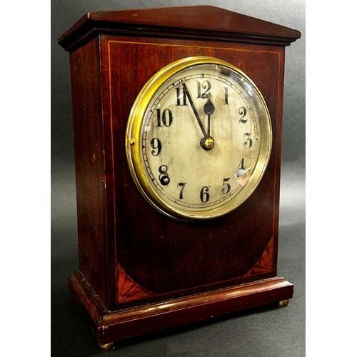 434 - An inlaid mahogany Edwardian mantle clock, with silvered dial, pendulum