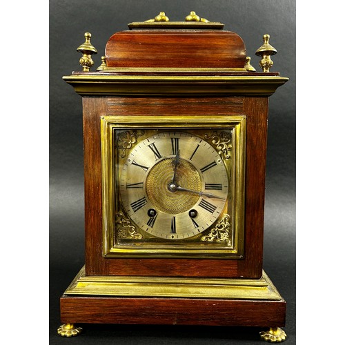 454 - A late 19th century Georgian style bracket clock, the rosewood case with applied brass detail, the d... 