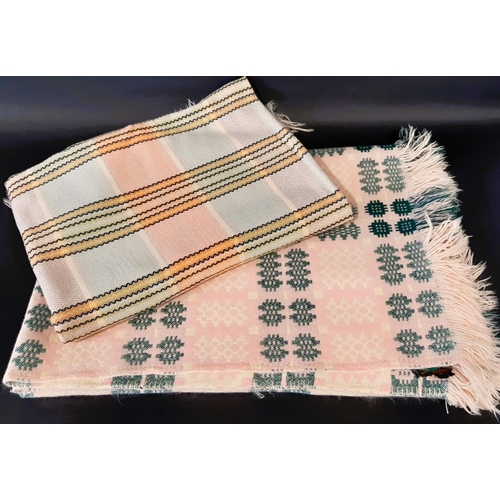 882 - A traditional woollen Welsh blanket of reversible double weave in pink, green, white and cream colou... 