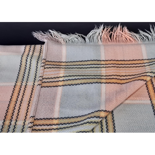 882 - A traditional woollen Welsh blanket of reversible double weave in pink, green, white and cream colou... 