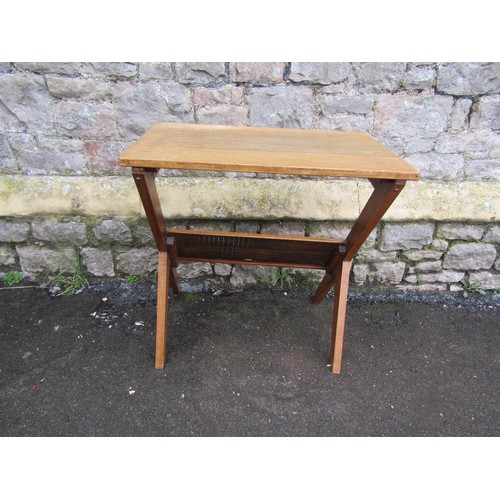 1181 - Mid 20th century writing desk/work table of rectangular form with under shelf, raised on X framed su... 