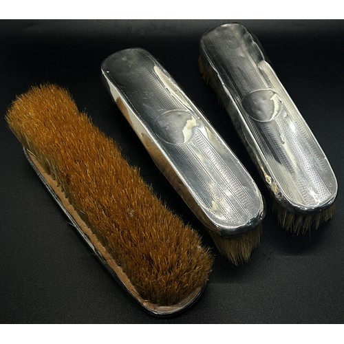 199 - An assortment of six silver backed brushes and a single silver hand mirror (7)