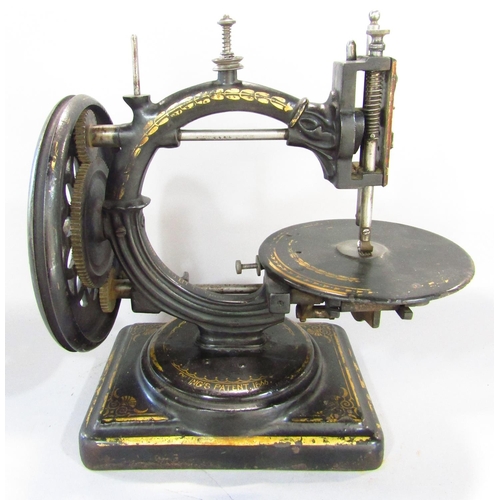 530 - A scarce Nussey & Pilling 'Little Stranger' Victorian sewing machine with gilt decoration, on metal ... 