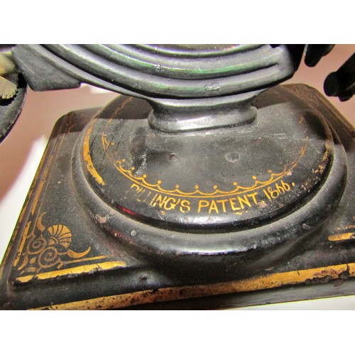 530 - A scarce Nussey & Pilling 'Little Stranger' Victorian sewing machine with gilt decoration, on metal ... 