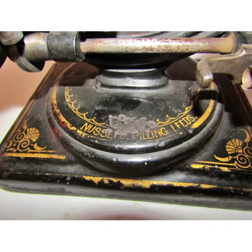 530 - A scarce Nussey & Pilling 'Little Stranger' Victorian sewing machine with gilt decoration, on metal ... 