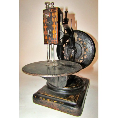 530 - A scarce Nussey & Pilling 'Little Stranger' Victorian sewing machine with gilt decoration, on metal ... 