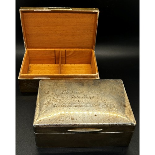 163 - A silver cigarette box engraved with inscriptions, together with a matching similar cigarette box (2... 