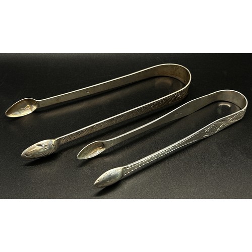 165 - A group of five silver sugar tongs in various designs, 6 ozs approximately