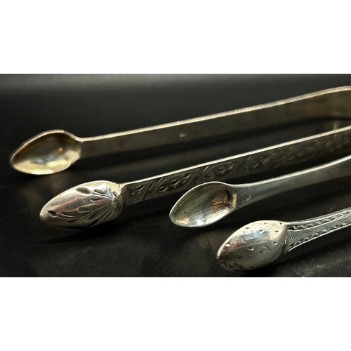 165 - A group of five silver sugar tongs in various designs, 6 ozs approximately