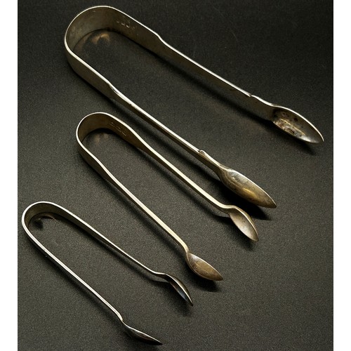 165 - A group of five silver sugar tongs in various designs, 6 ozs approximately