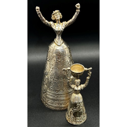 168 - A silver table bell in the form of a dancing woman, with English hallmarks, together with a miniatur... 