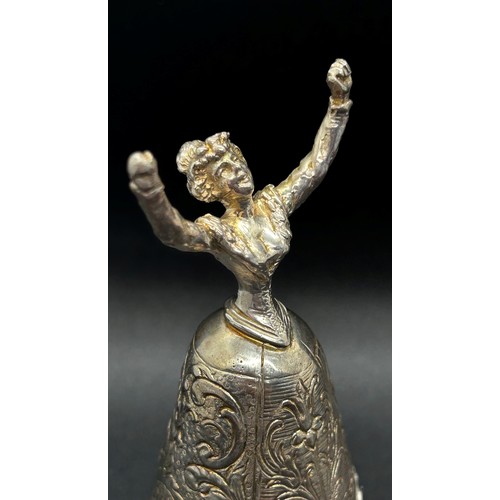 168 - A silver table bell in the form of a dancing woman, with English hallmarks, together with a miniatur... 