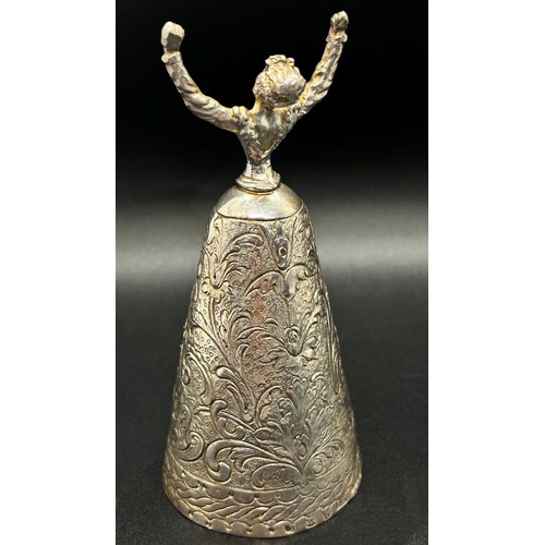 168 - A silver table bell in the form of a dancing woman, with English hallmarks, together with a miniatur... 