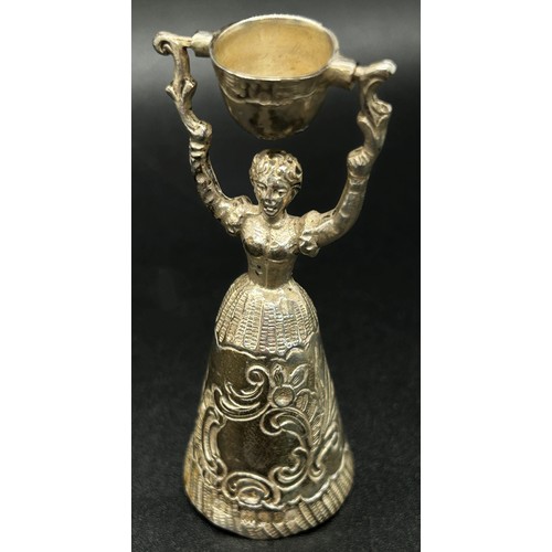 168 - A silver table bell in the form of a dancing woman, with English hallmarks, together with a miniatur... 