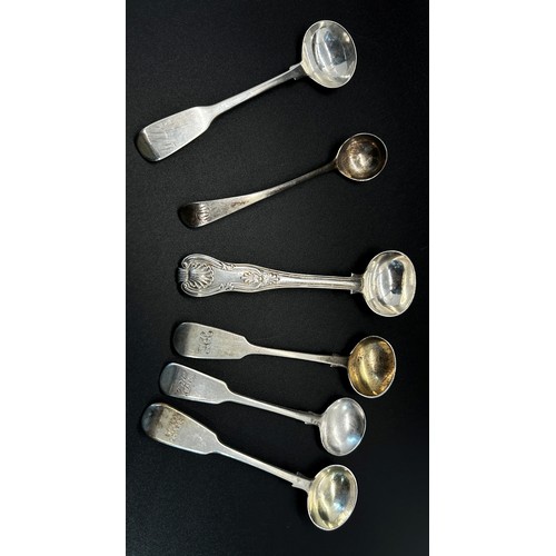 169 - A silver group of twelve mustard spoons in mixed designs, 4.8 ozs approximately