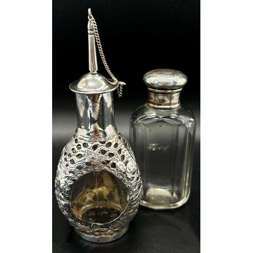 176 - A mixed collection of silver vanity sets including cotton wool bottle, a perfume bottle, all with si... 