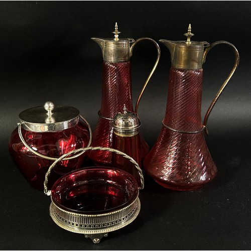 144 - A mixed selection of 19th century Cranberry glassware including a pair of claret jugs, a decanter, b... 