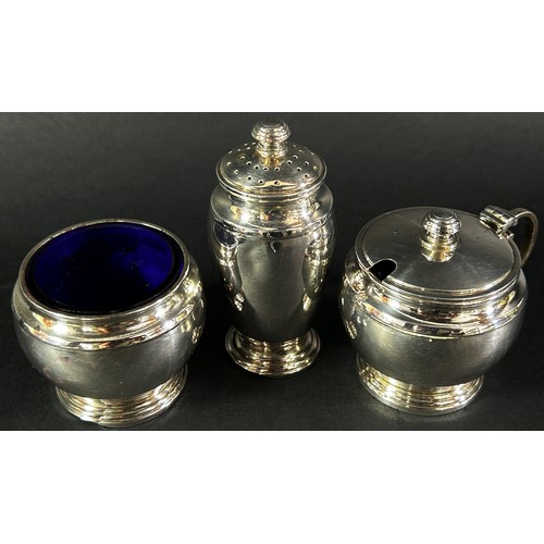 205 - A cased set of Art Deco silver condiments, Birmingham 1921, maker Adie Brothers Ltd, all with origin... 