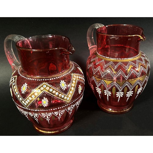 147 - A varied collection of Bohemian and Cranberry glassware, including a Bohemian glass overlay vase and... 