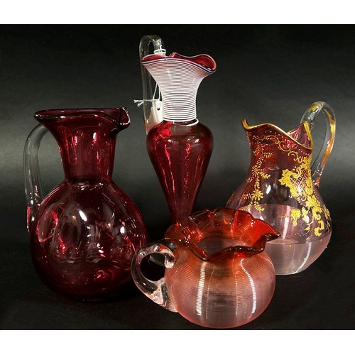 147 - A varied collection of Bohemian and Cranberry glassware, including a Bohemian glass overlay vase and... 