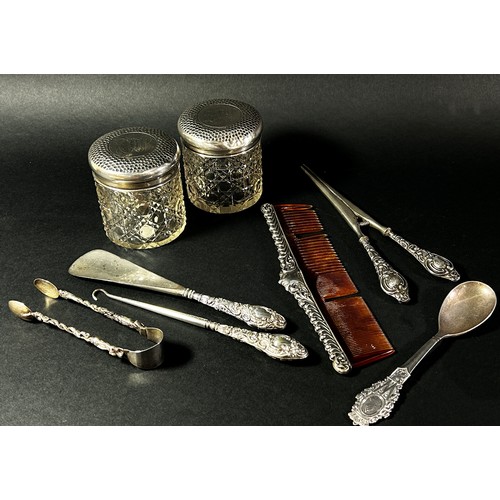 209 - A matching set of three silver dressing accessories, a shoehorn glove stretcher, a button hook, a co... 