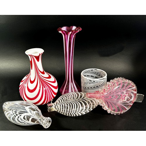 148 - A collection of 19th century Nailsea glassware, including a pink candy stripe bellows, two flats bot... 