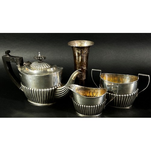 213 - A three piece silver tea set, Birmingham 1900 maker Henry Willliamson Ltd, and a weighted silver vas... 