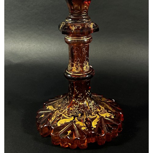 151 - A 19th century tall Bohemian Gothic amber decorated glass vase, with a curved crenellated rim raised... 