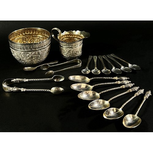 220 - A selection of silver to include a christening set, teaspoons, six  Apostle spoons, a sugar tong  

... 