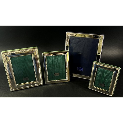 222 - Three Harrods sterling silver rectangular photo frames with Harrods green silk backing, together wit... 