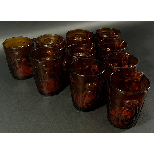 154 - Ten Erik Hoglund amber coloured drinking glasses, decorated with naked people, some with original st... 