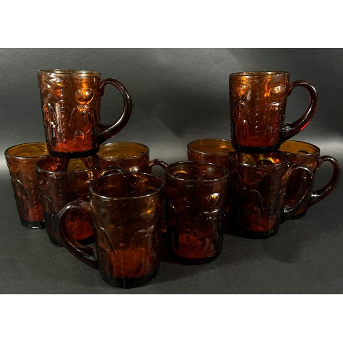 154 - Ten Erik Hoglund amber coloured drinking glasses, decorated with naked people, some with original st... 