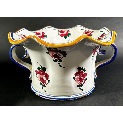 72 - A French vase with scrolled handles and fluted neck and with hand painted floral detail