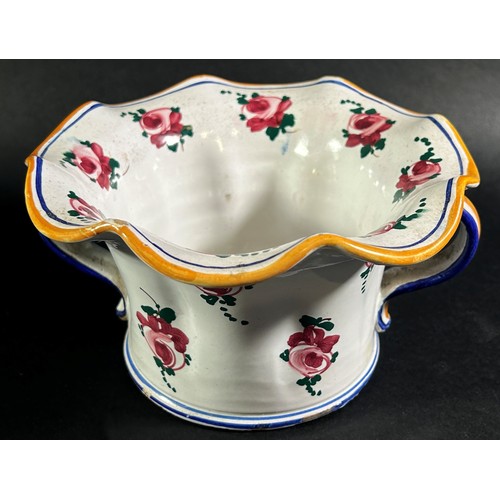 72 - A French vase with scrolled handles and fluted neck and with hand painted floral detail