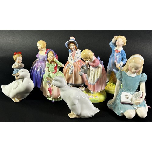 73 - A collection of Royal Doulton figures including Alice, Mary Mary, and others together with two Nao d... 