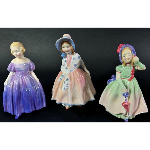 73 - A collection of Royal Doulton figures including Alice, Mary Mary, and others together with two Nao d... 