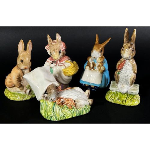 76 - A collection of Royal Albert Beatrix Potter figures with brown back stamps, together with a Crown de... 