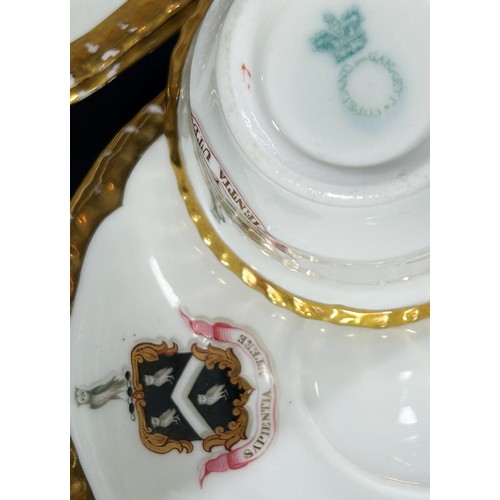 77 - A Copeland Armorial part tea/dinner service comprising two large plates, four side plates, three tea... 