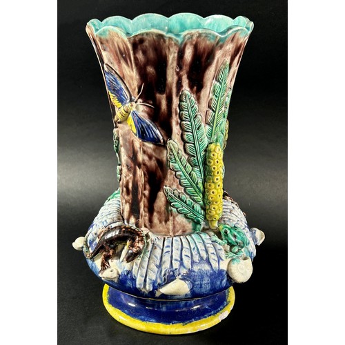 79 - A late 19th century majolica vase, the fluted neck set within a circular ring encrusted with lizards... 