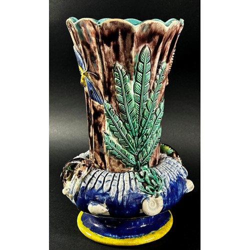 79 - A late 19th century majolica vase, the fluted neck set within a circular ring encrusted with lizards... 