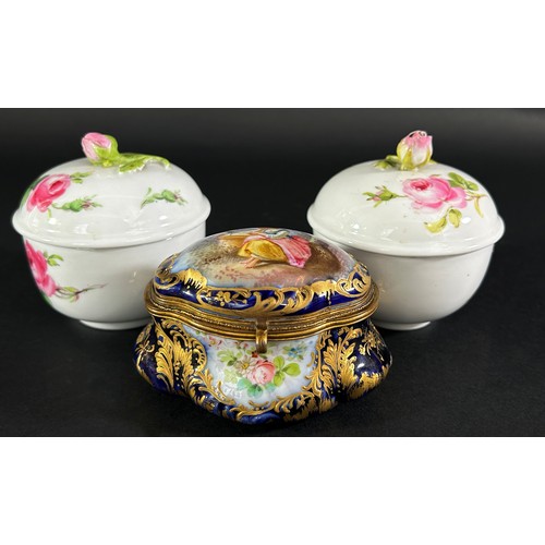 85 - Two Meissen pots and covers with rose finials together with a small Sevres blue and gilt lidded trin... 