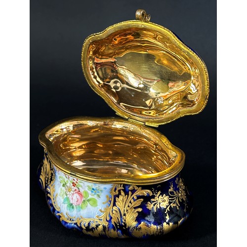 85 - Two Meissen pots and covers with rose finials together with a small Sevres blue and gilt lidded trin... 