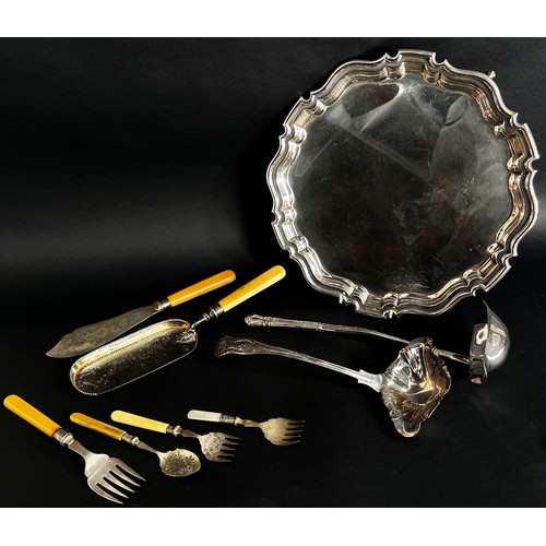 264 - A Georgian style silver plated scalloped edged salver, an egg cruet, a fruit bowl, two punch ladle, ... 