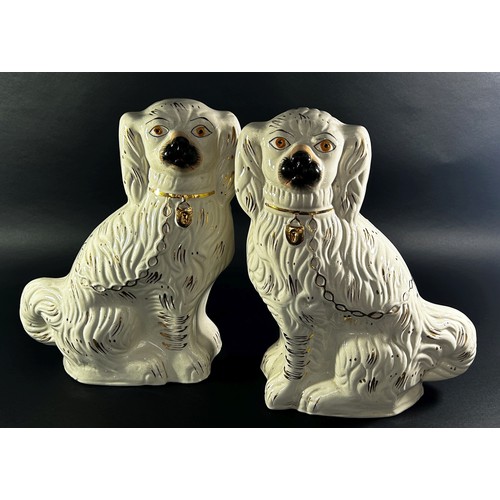 89 - A large pair of Staffordshire dogs with gilt detail, 40cm high approx