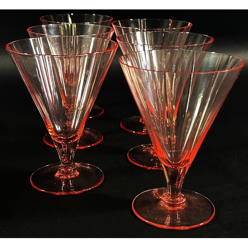 140 - An Art Deco pink glass drinks set, with a single jug and six conical glasses.