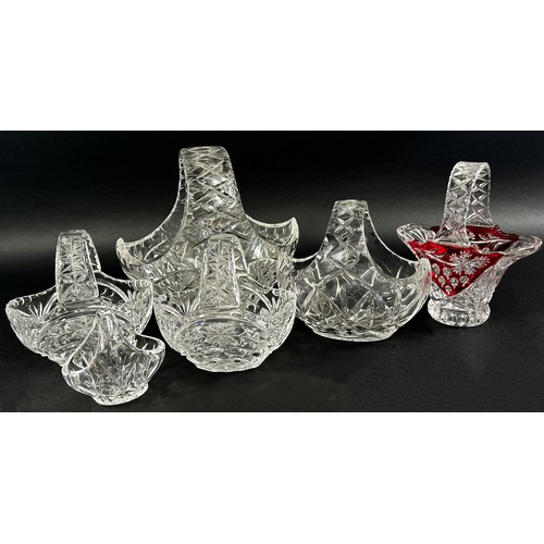 155 - A collection of lead crystal glass including six glass baskets, two bowls, a pair of square stemmed ... 