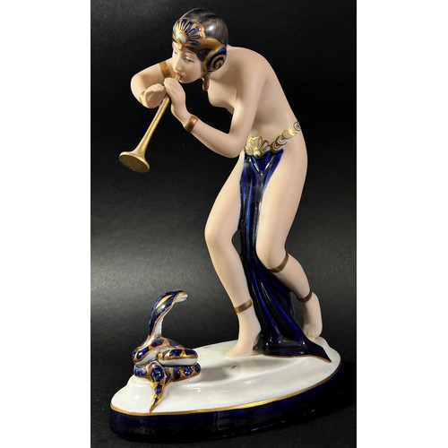 63 - Royal Dux Snake Charmer figure, together with a pair of Royal Dux Bunny's