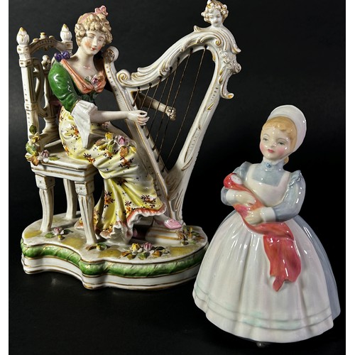 103 - A 19th century German group - female harpist, a Doulton figure - The Puppet Maker, HN2253, The Cup o... 